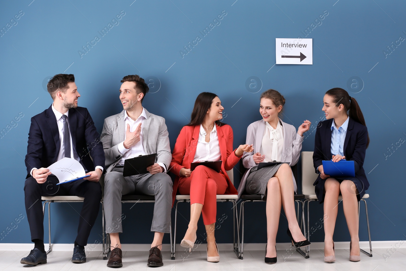 Photo of Group of people waiting for job interview, indoors