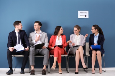 Group of people waiting for job interview, indoors