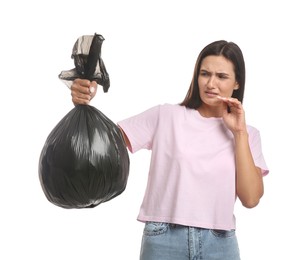 Woman holding full garbage bag on white background