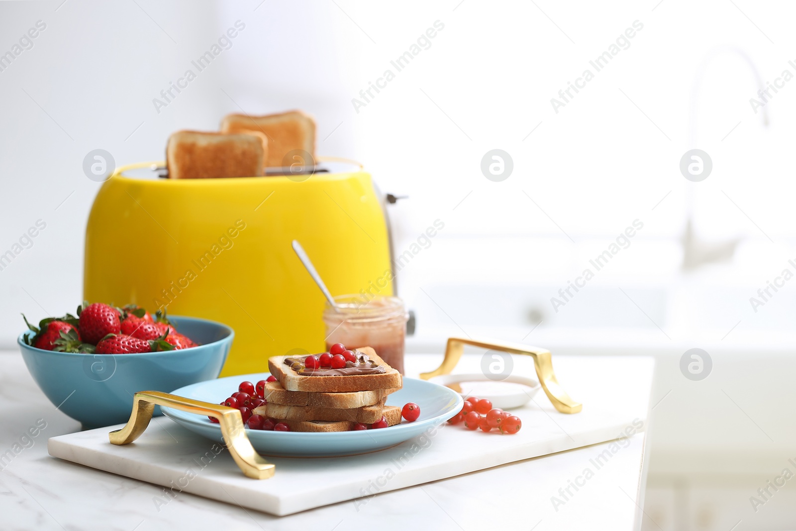 Photo of Toaster and sandwiches on white marble table in kitchen. Space for text