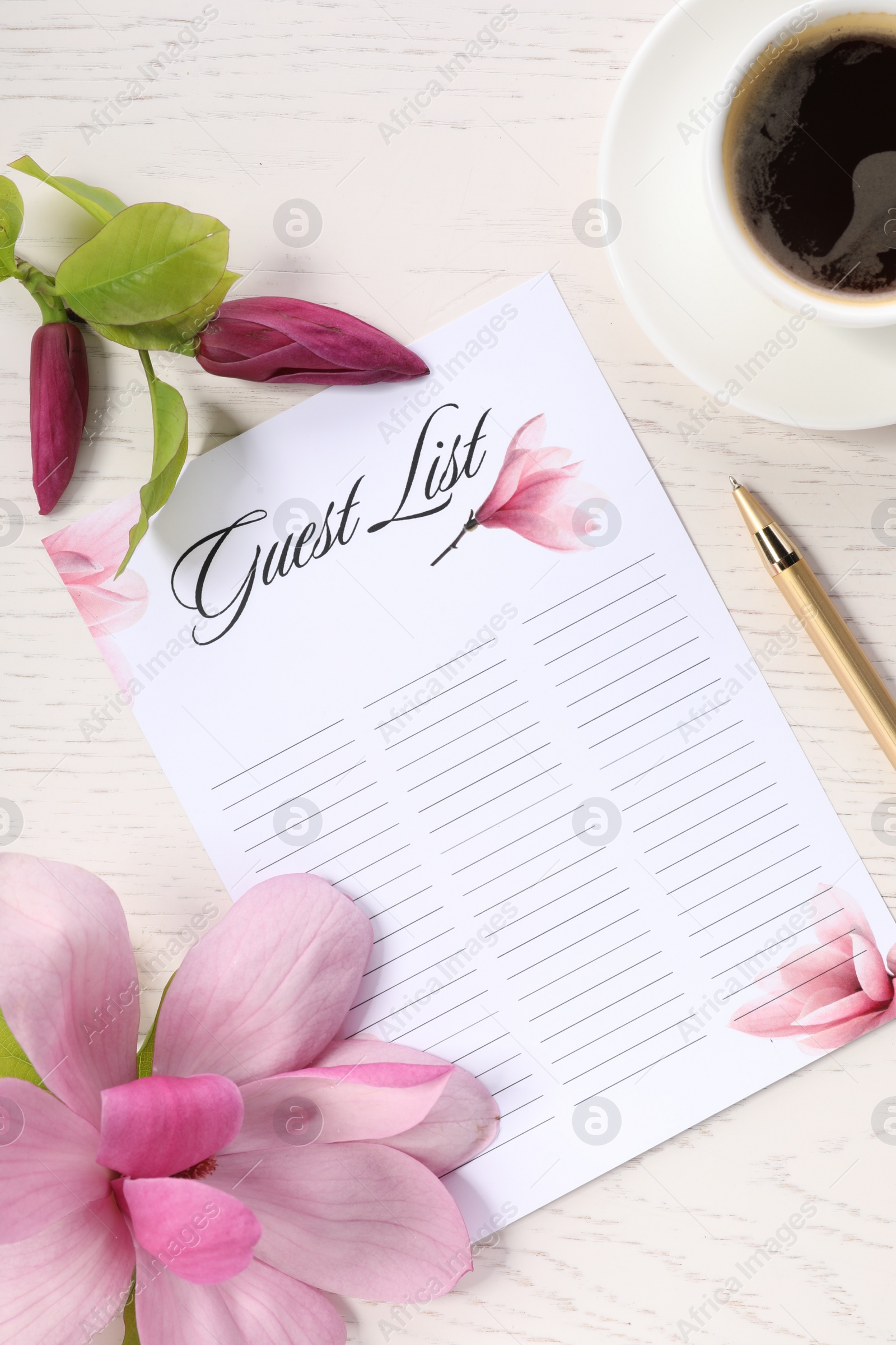 Photo of Guest list, coffee, pen and beautiful flowers on white wooden table, flat lay. Space for text