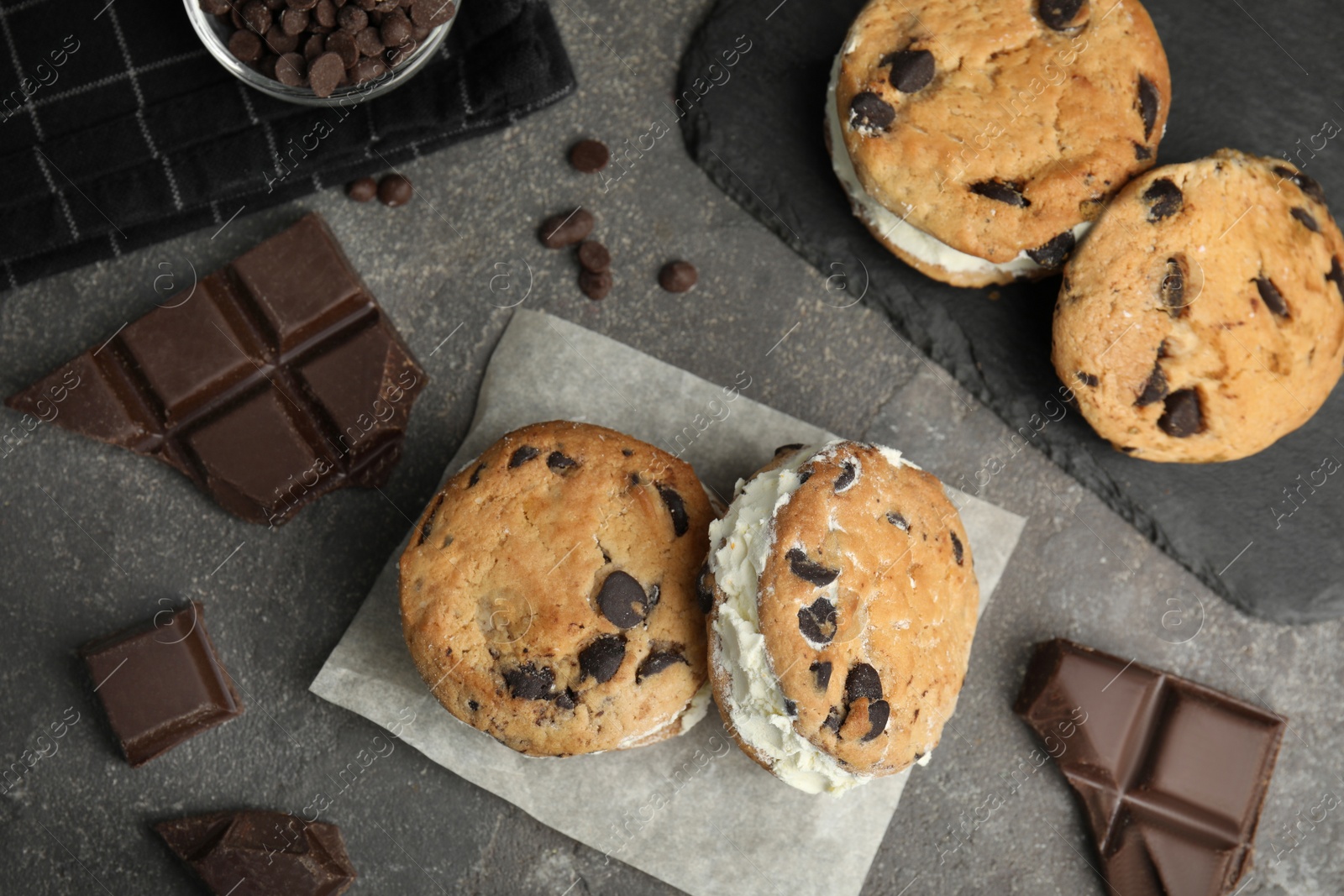 Photo of Flat lay composition with sweet delicious ice cream cookie sandwiches on table