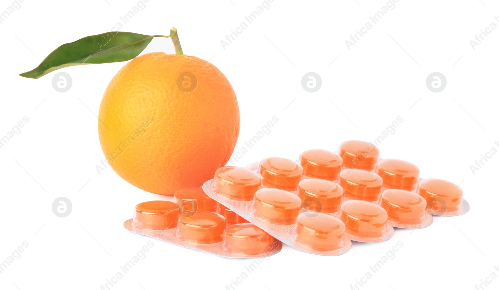 Photo of Fresh orange and blisters with cough drops isolated on white