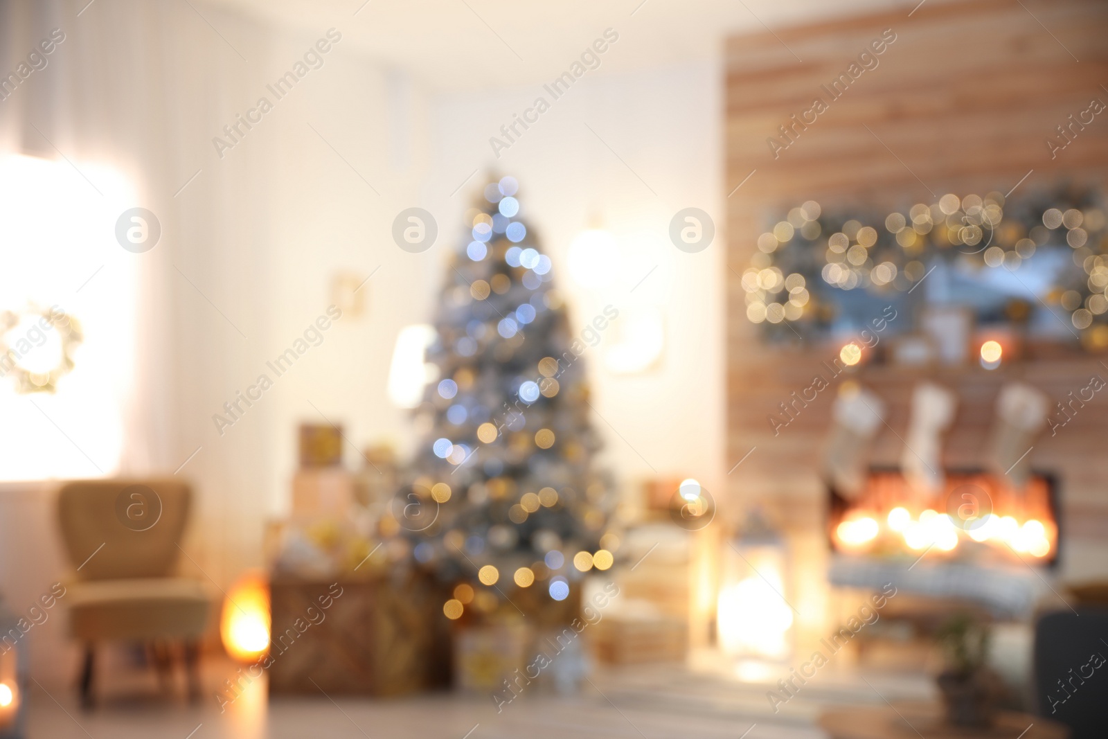 Photo of Blurred view of living room interior with decorated Christmas tree