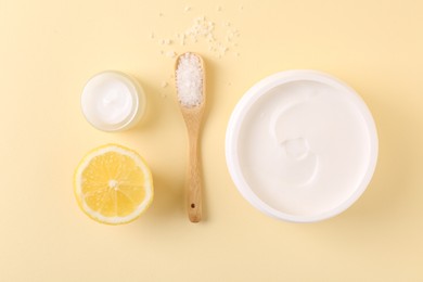 Flat lay composition with jars of cream on beige background. Body care product