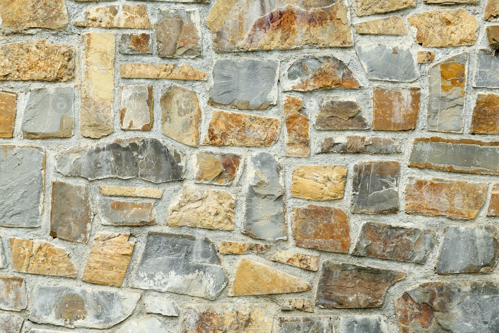 Photo of Texture of stone wall as background, closeup