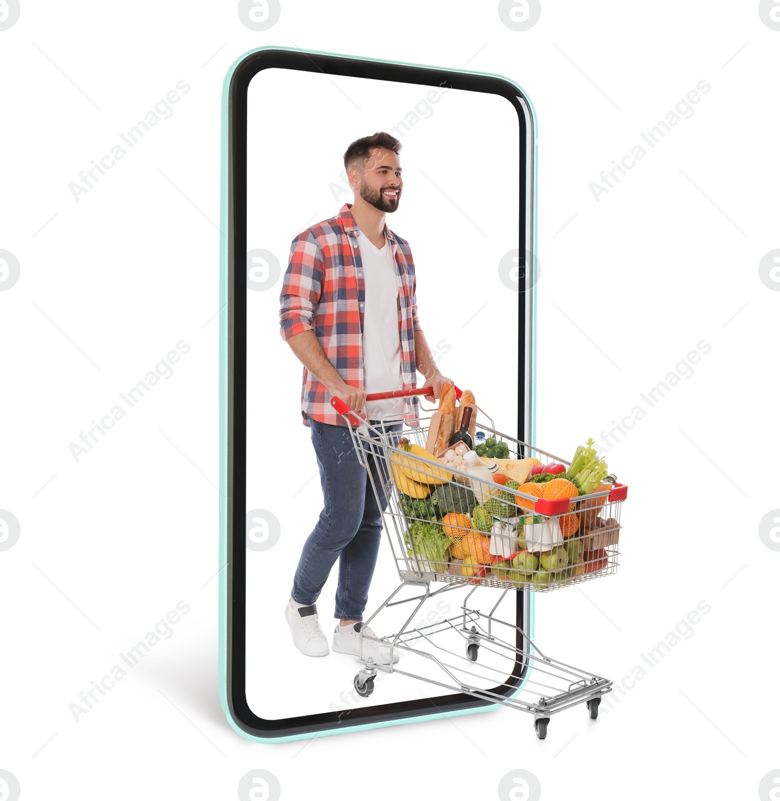 Image of Happy man with shopping cart full of groceries walking out huge smartphone on white background. Advertising design