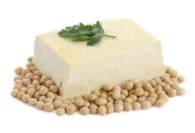 Photo of Piece of delicious tofu with parsley and soy on white background