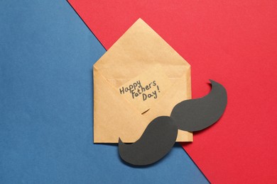 Photo of Card with phrase Happy Father's Day and paper mustache on color background, top view