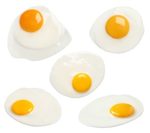 Image of Set with tasty fried eggs on white background
