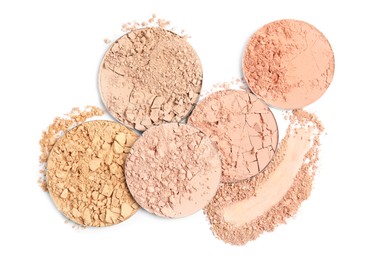 Photo of Different face powders and swatch on white background, top view
