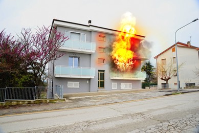 Image of Modern house engulfed in flames. Fire safety violations