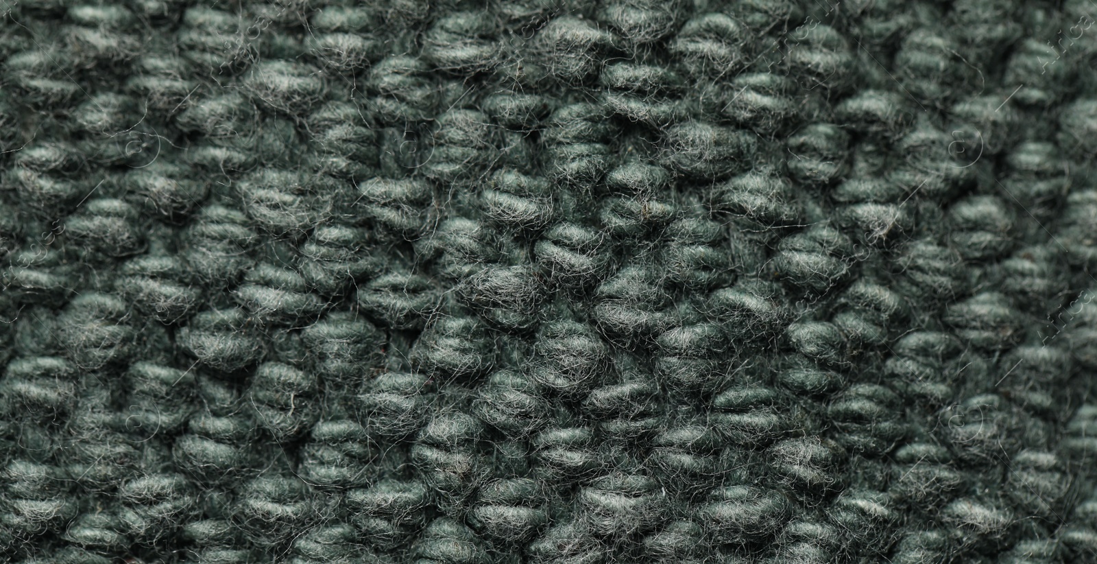 Photo of Texture of soft grey knitted fabric as background, top view