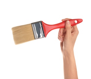 Photo of Woman holding paint brush on white background, closeup