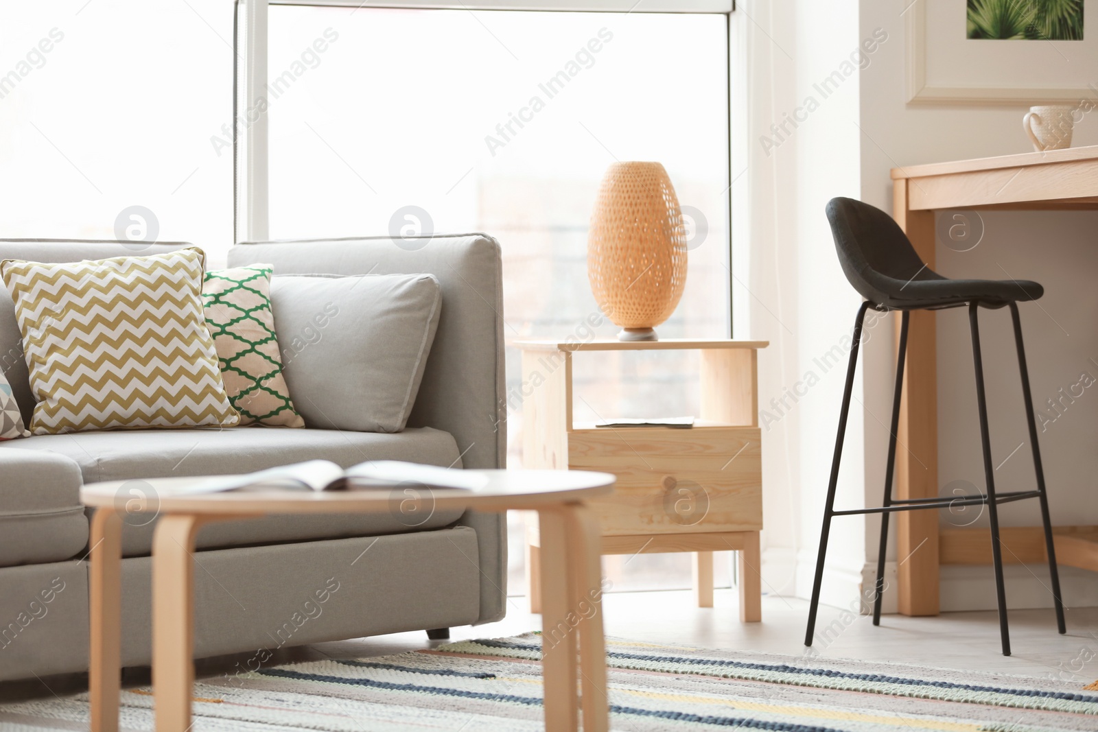 Photo of Stylish living room interior with comfortable sofa