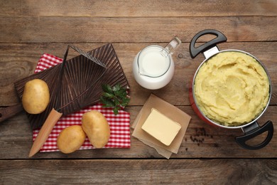 Photo of Flat lay composition with tasty mashed potatoes and ingredients on wooden table