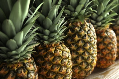 Photo of Closeup view of fresh ripe juicy pineapples