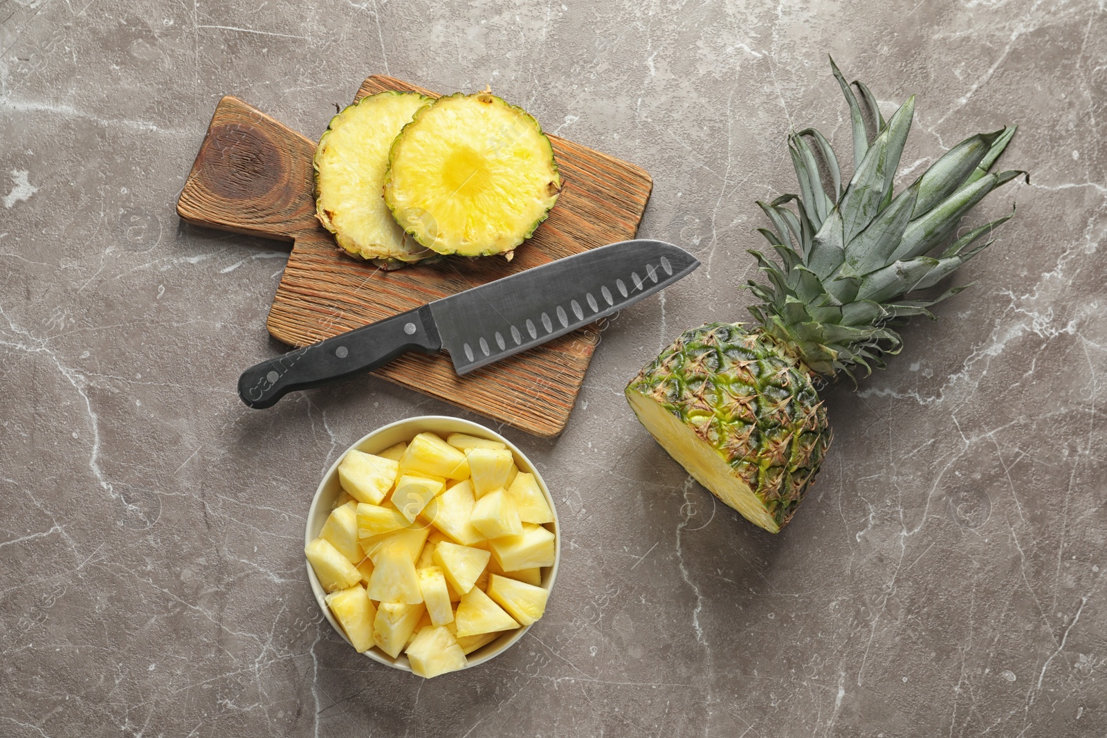 Photo of Flat lay composition with fresh sliced pineapple on wooden background