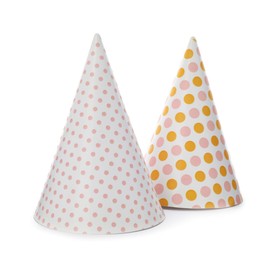 Photo of Bright party hats on white background. Festive accessory