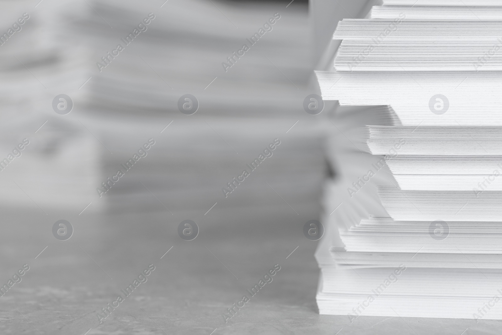 Photo of Stack of blank white paper on table, closeup. Space for text