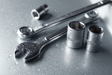 Photo of Auto mechanic's tools on metallic surface, closeup
