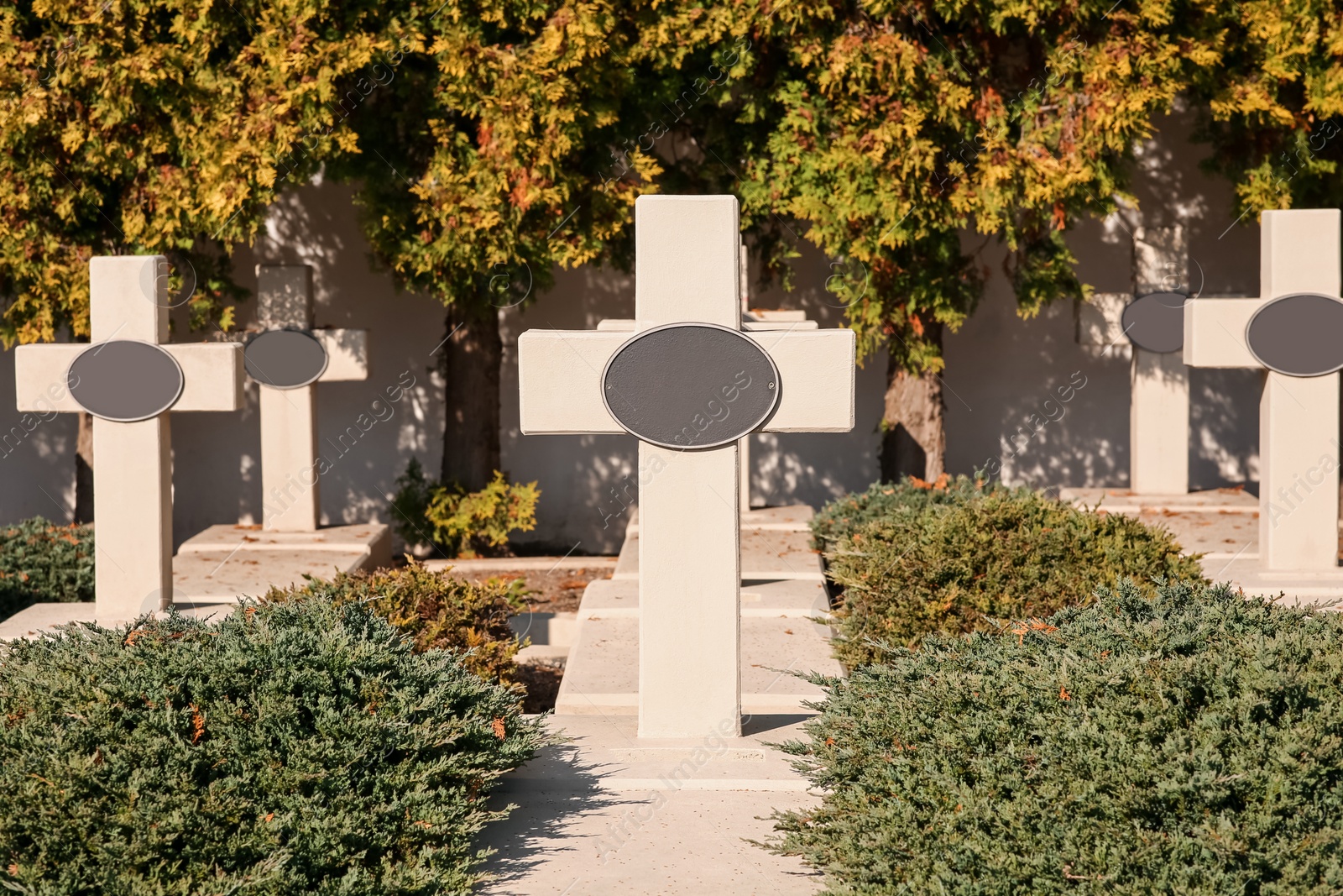 Photo of Many granite tombstones at cemetery. Religious tradition