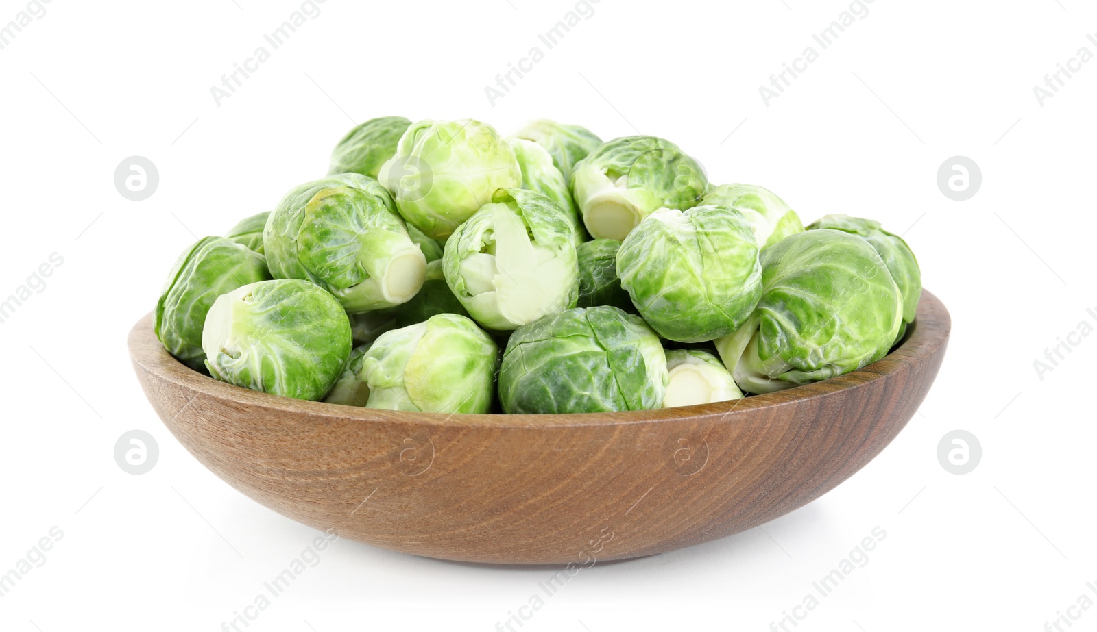 Photo of Fresh Brussels sprouts in bowl isolated on white