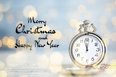 Image of Merry Christmas and Happy New Year. Pocket watch on table against blurred lights