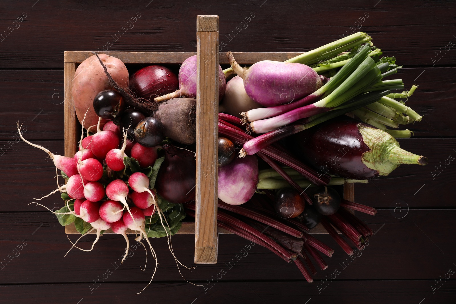 Photo of Different fresh ripe vegetables on wooden table, top view