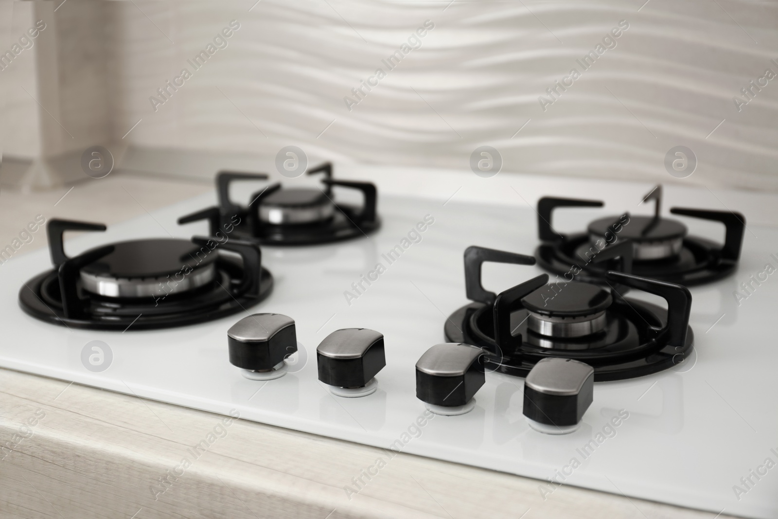 Photo of Modern built-in gas cooktop. Kitchen appliance