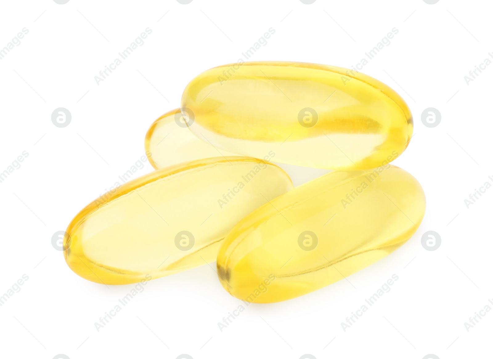 Photo of Many yellow vitamin capsules isolated on white