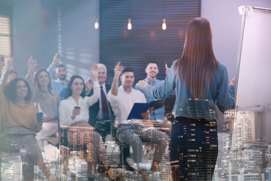 Double exposure of team workers at seminar in conference hall and night cityscape