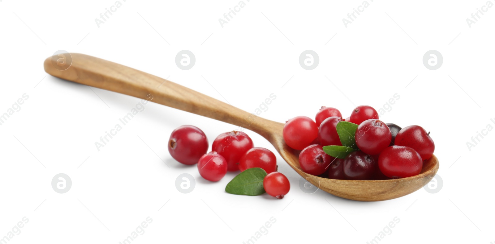 Photo of Wooden spoon and fresh ripe cranberries with leaves isolated on white