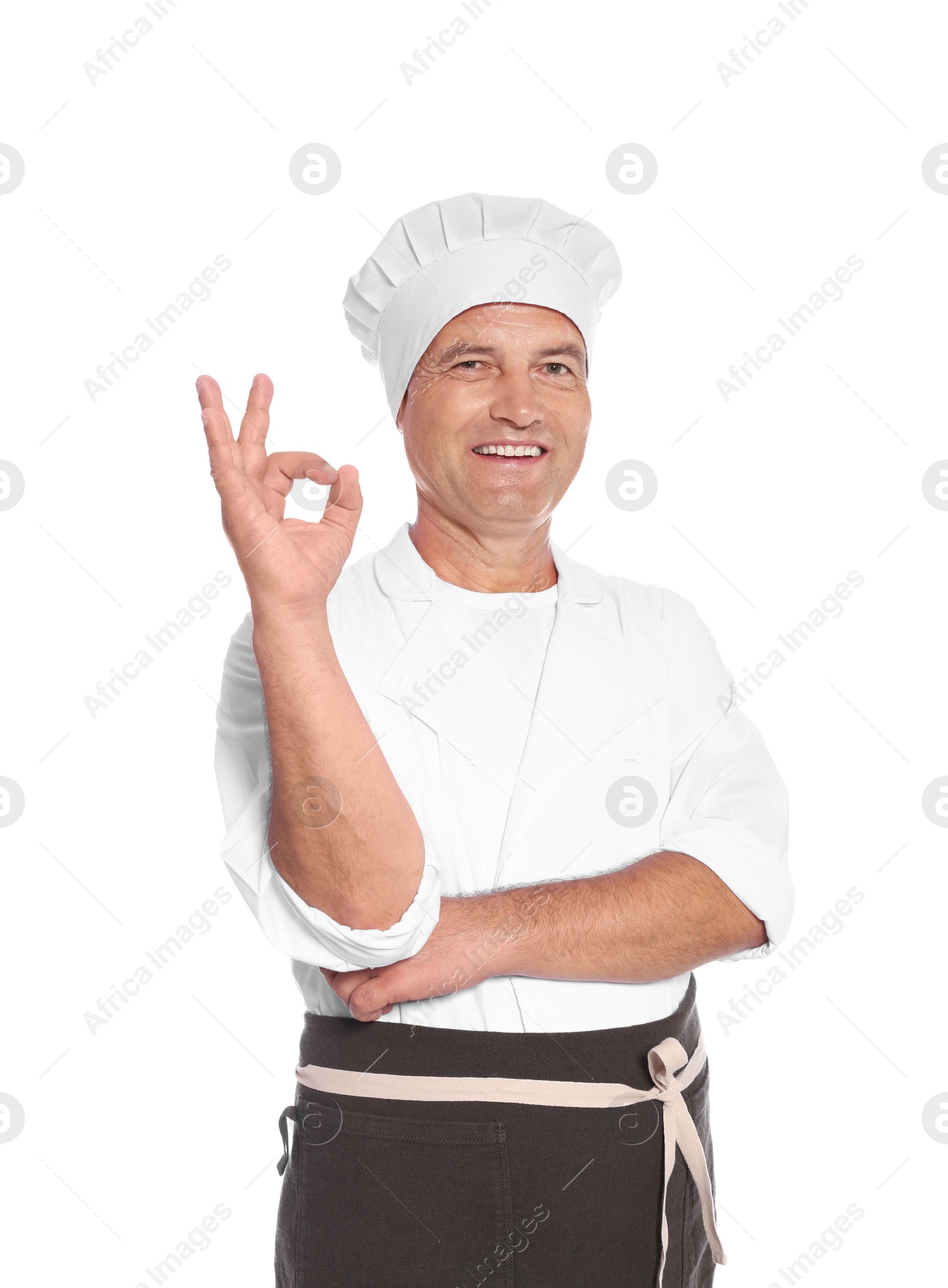 Photo of Mature male chef showing perfect sign on white background