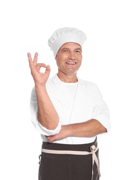 Photo of Mature male chef showing perfect sign on white background