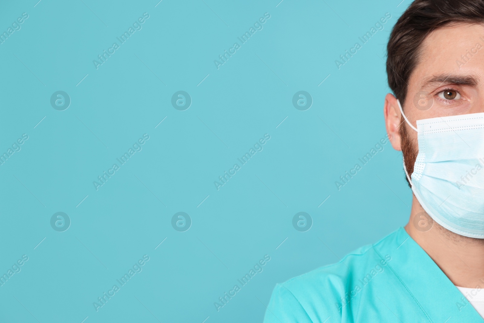 Photo of Nurse with medical mask on light blue background, closeup. Space for text