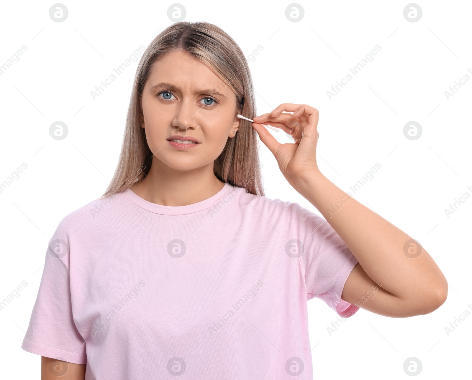 Photo of Young woman cleaning ear with cotton swab on white background