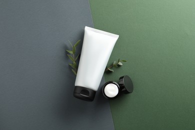 Photo of Tube and jar of men's facial cream on color background, flat lay