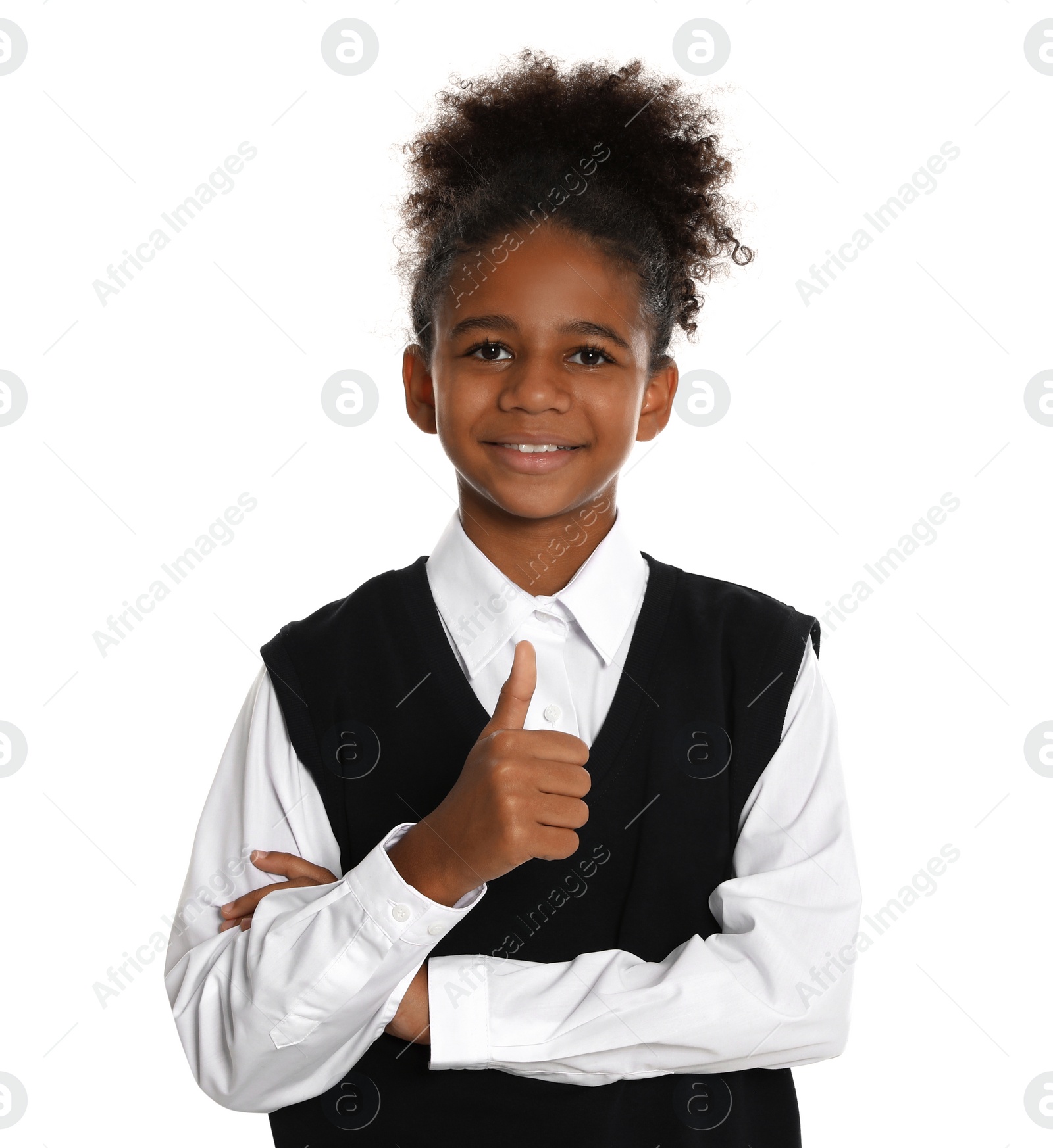 Photo of Happy African-American girl in school uniform on white background