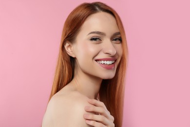 Photo of Portrait of beautiful young woman on pink background