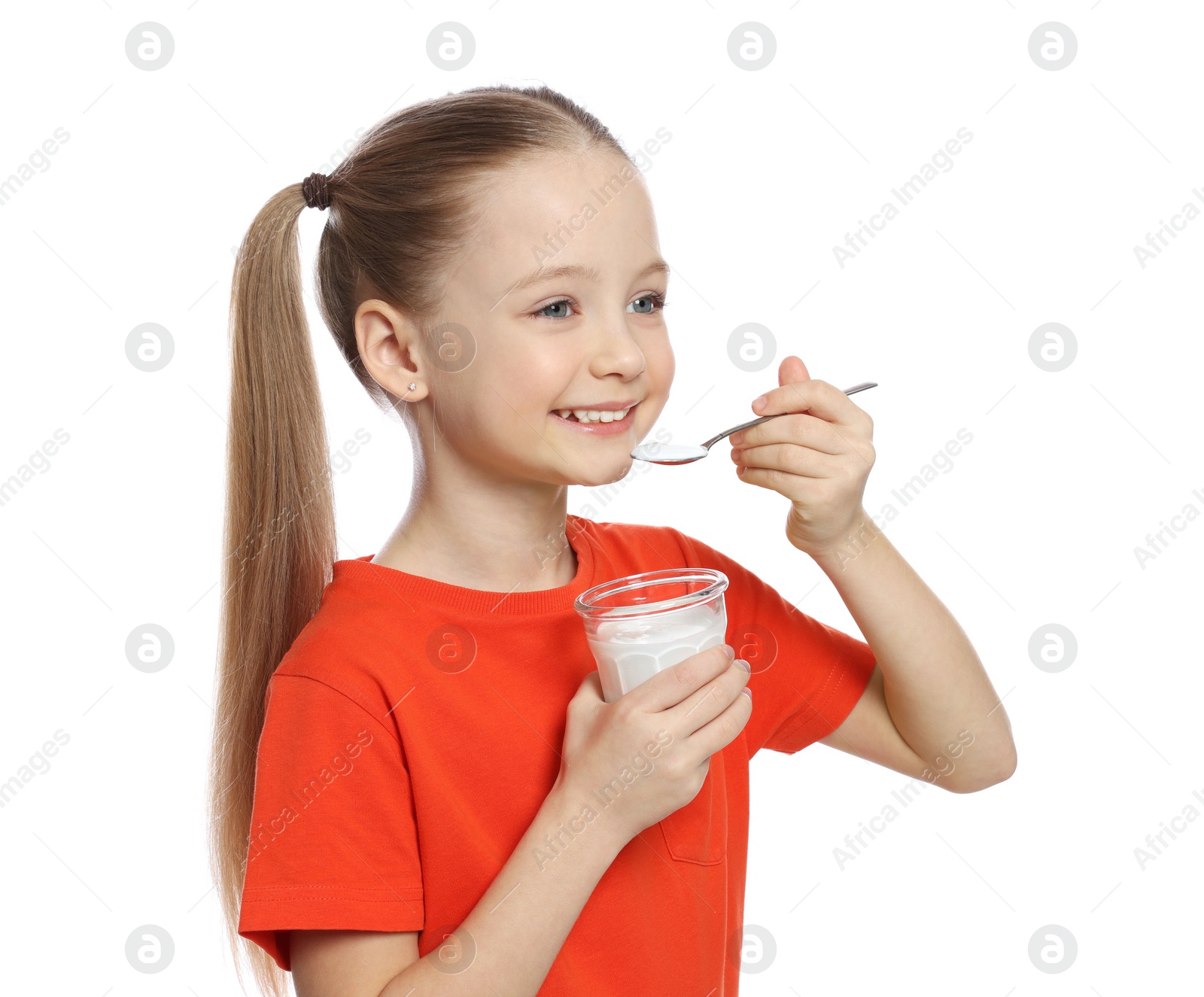 Photo of Cute little girl with tasty yogurt on white background