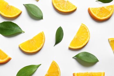 Composition with orange slices on white background, top view