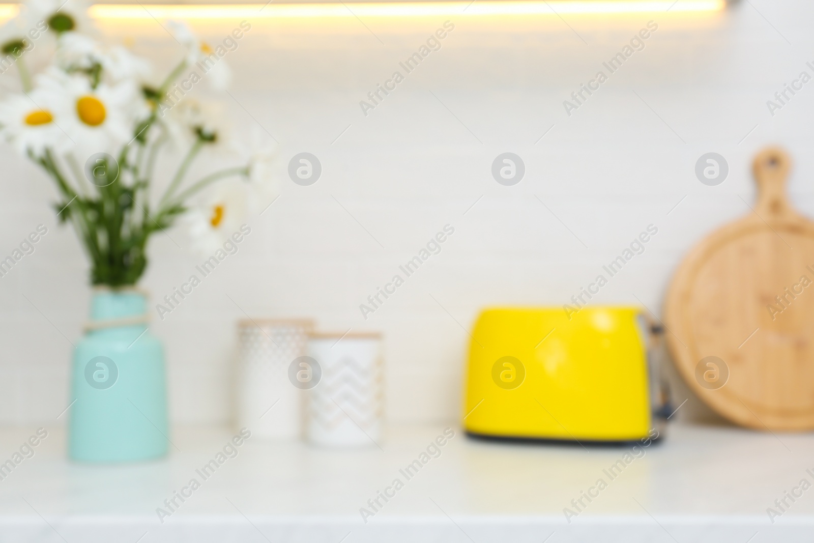 Photo of Blurred view of modern kitchen with toaster