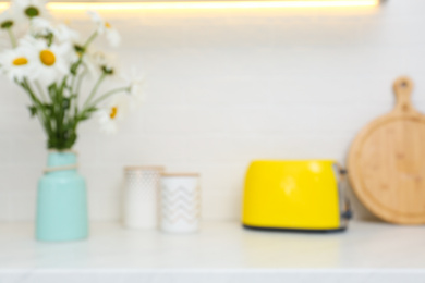 Blurred view of modern kitchen with toaster