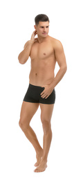 Photo of Handsome man in black underwear on white background