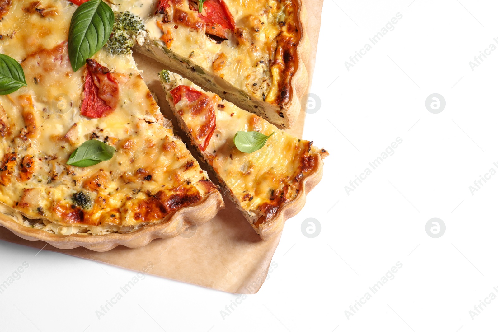 Photo of Tasty quiche with tomatoes, basil and cheese on white background, top view. Space for text