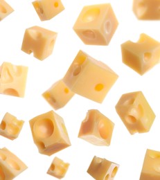 Image of Pieces of delicious cheese falling on white background 