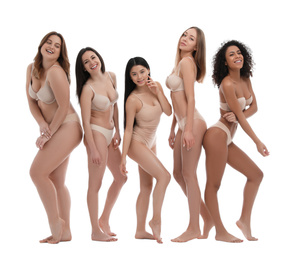 Photo of Group of women with different body types in underwear on white background