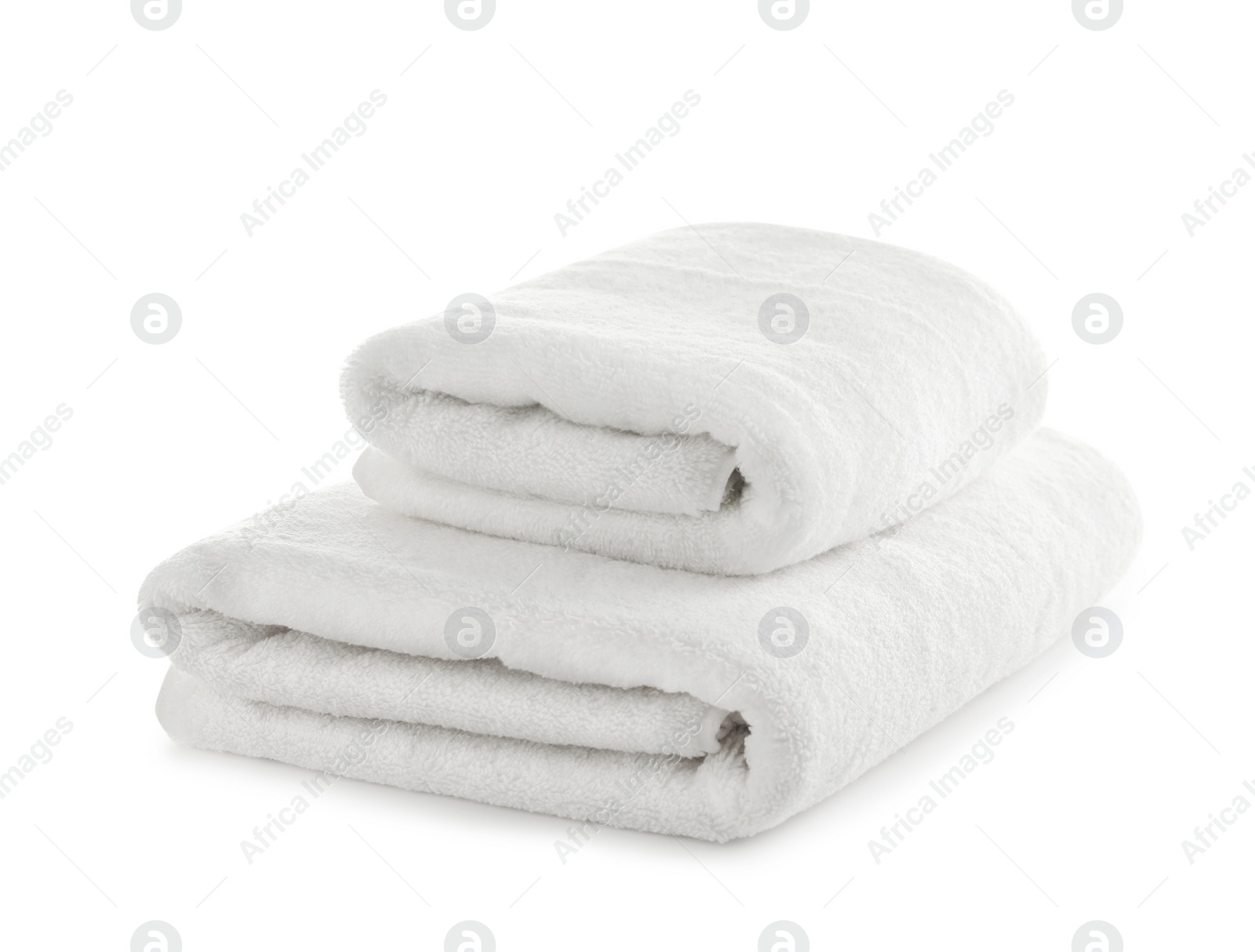 Photo of Folded clean soft towels on white background