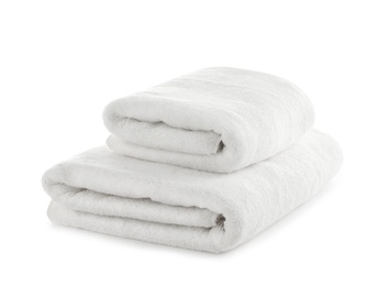 Folded clean soft towels on white background